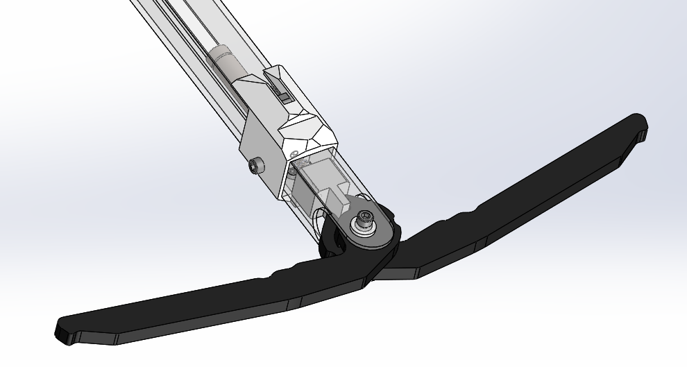 Close-up CAD of the bolt tip with the black barbs open and the release piston inside the clear body