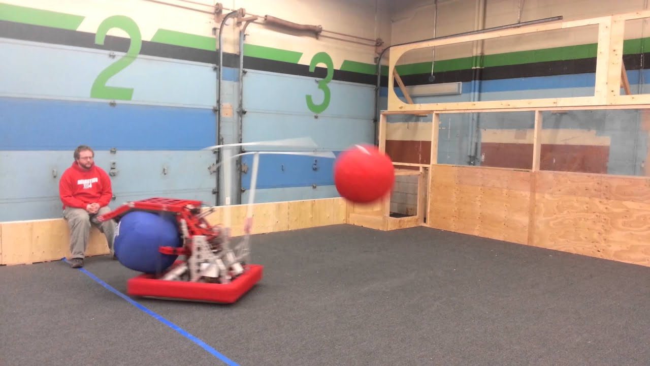 Team 1114’s robot shooting a large red ball across the practice field