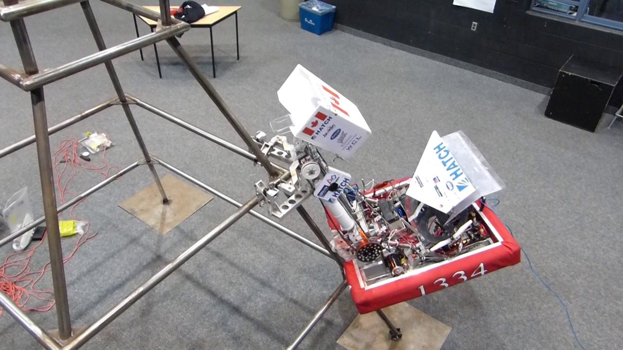 Team 1334’s robot hooked onto the corner of a practice pyramid