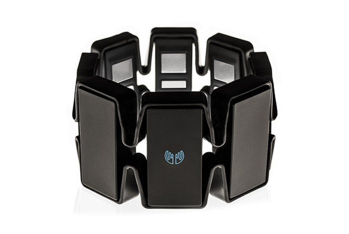 The finished Myo armband: eight black pods joined in a ring by a flexible band